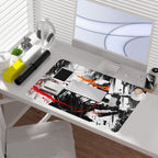 Michelangelo TMNT borderless playmat on a desk with keyboard and accessories, showcasing dynamic black noir art.