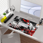 Raphael TMNT borderless playmat showcased on a desk with computer and accessories, featuring bold black and white art.